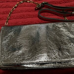 Rose gold metallic vinyl clutch